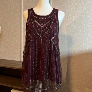 Vanity sleeveless top with beaded detailing